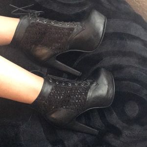 Black leather heel booties.